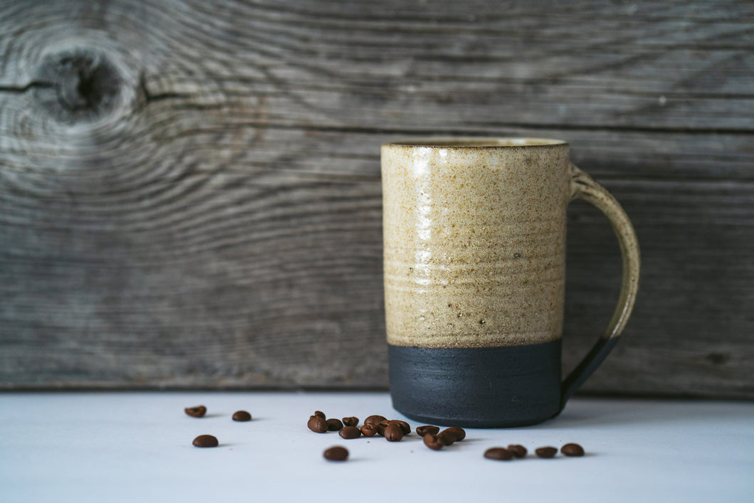 Tall mug in black clay