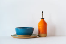 Load image into Gallery viewer, Orange oil dispenser along with a everyday bowl and side plate
