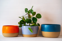 Load image into Gallery viewer, Wide table planter in orange, lavender and dark blue
