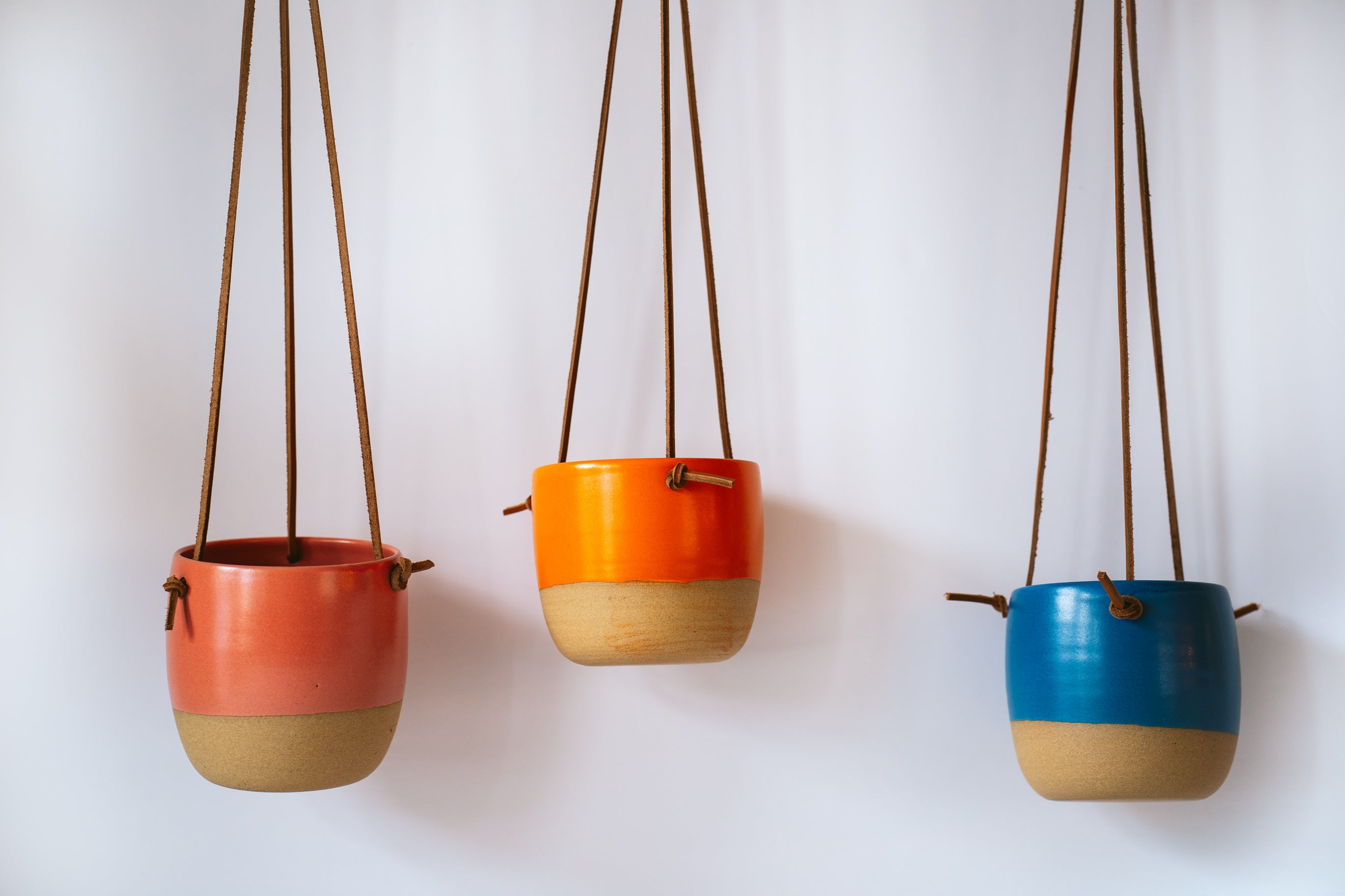 Small hanging planter in coral, orange and dark blue