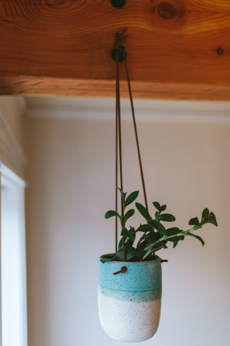 Medium tall hanging planter in half and half speckle