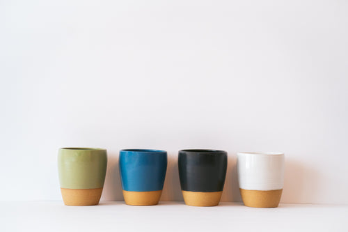 Line up of small tumblers in different tones